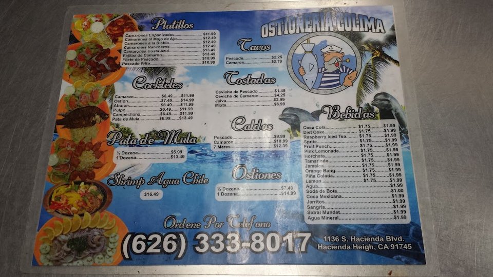 Menu board with tacos, soups, and oysters.